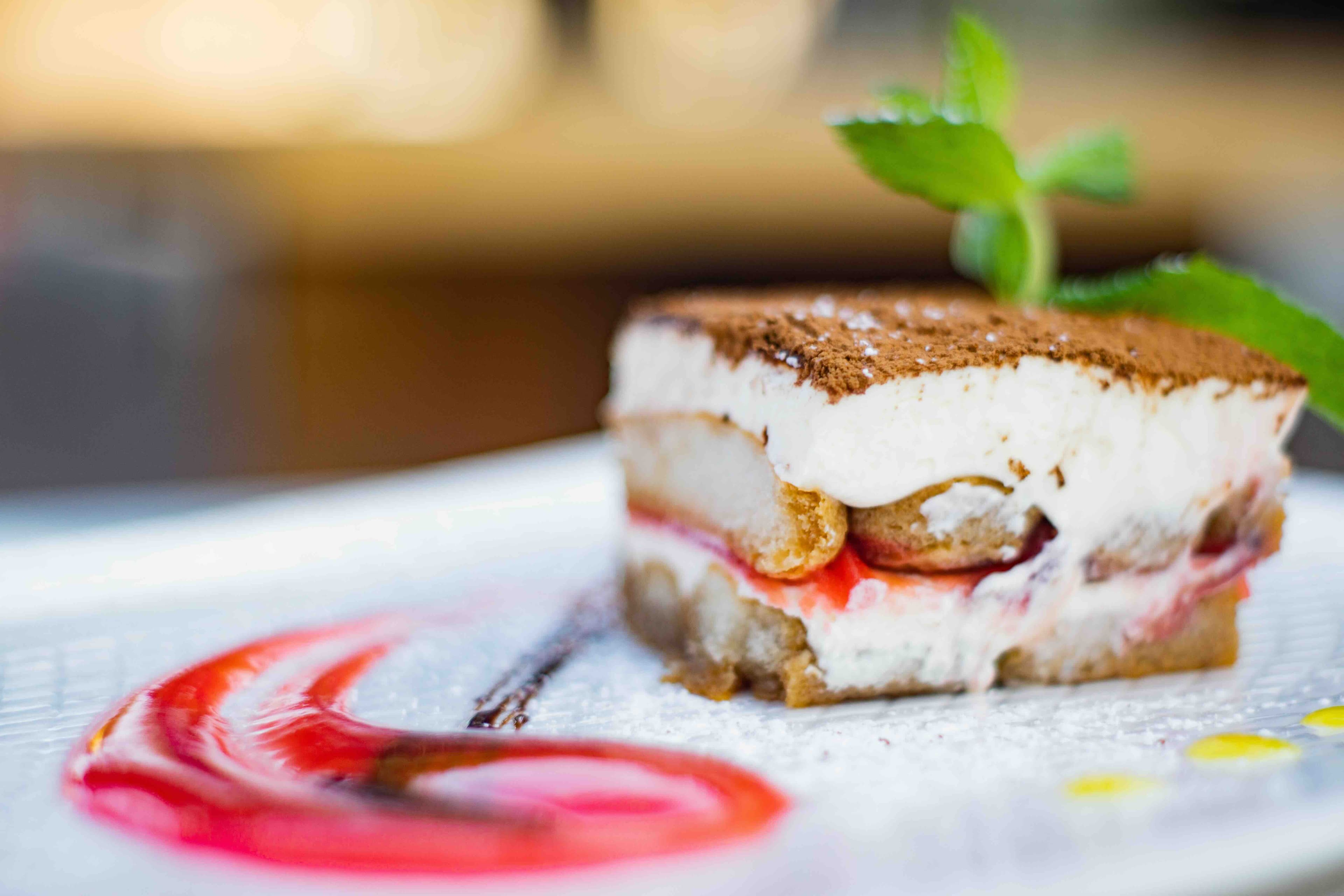 Tiramisu and sweets under the string lights.